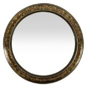 An early Victorian gilt decorated black lacquer framed circular wall mirror