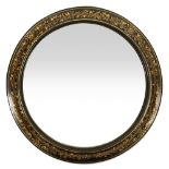 An early Victorian gilt decorated black lacquer framed circular wall mirror