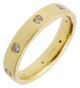 An 18ct yellow gold and diamond-set band ring