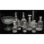 A pair of Whitefriars Spanish cut tri-form decanters and stoppers