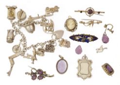 A small collection of mixed jewellery including a silver charm bracelet