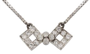 A stylised diamond-set bow pendant