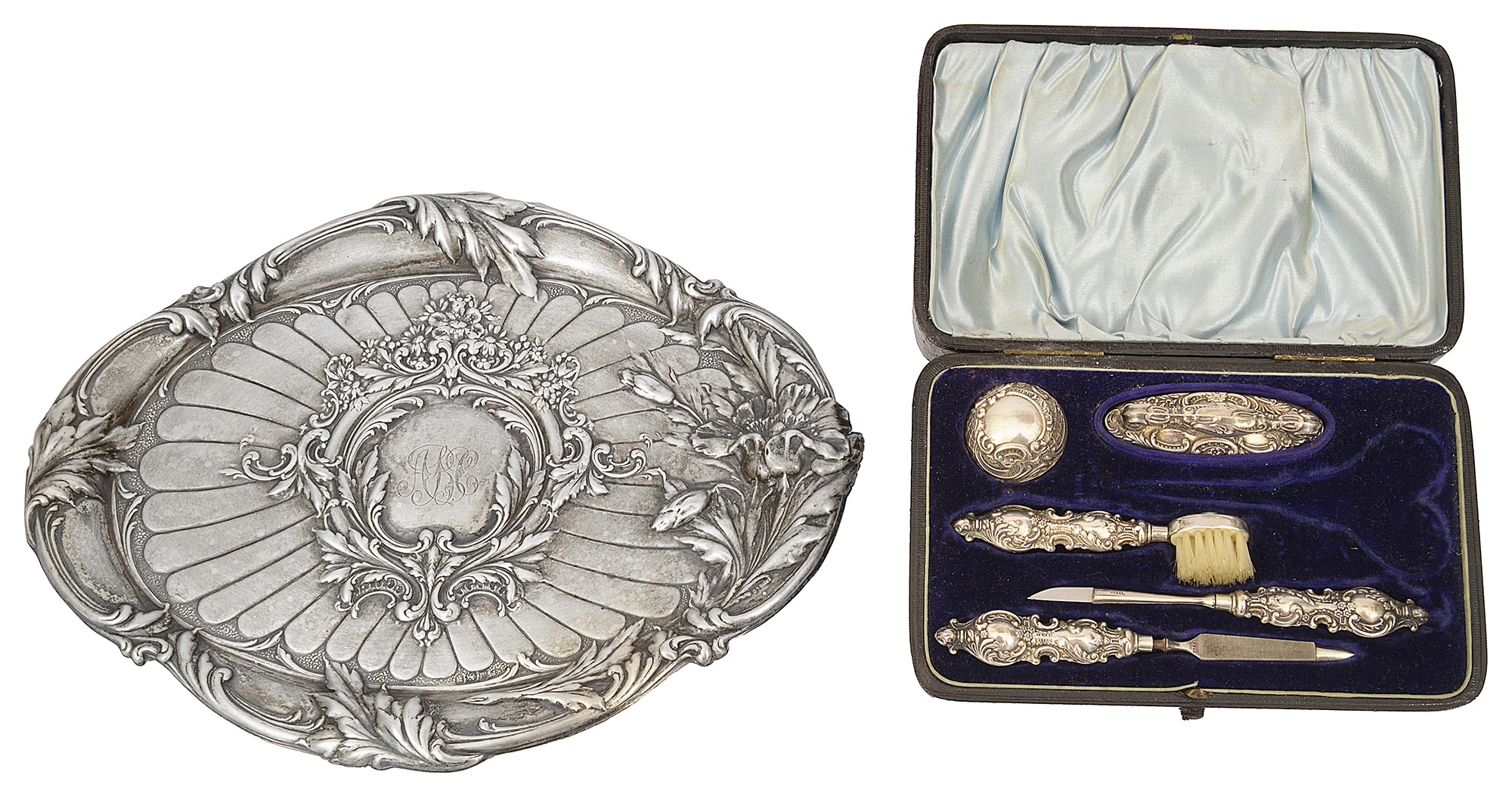 An Edwardian Art Nouveau silver embossed dressing table tray and a late Vict. cased manicure set