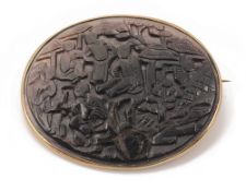 A Chinese carved nacre oval brooch