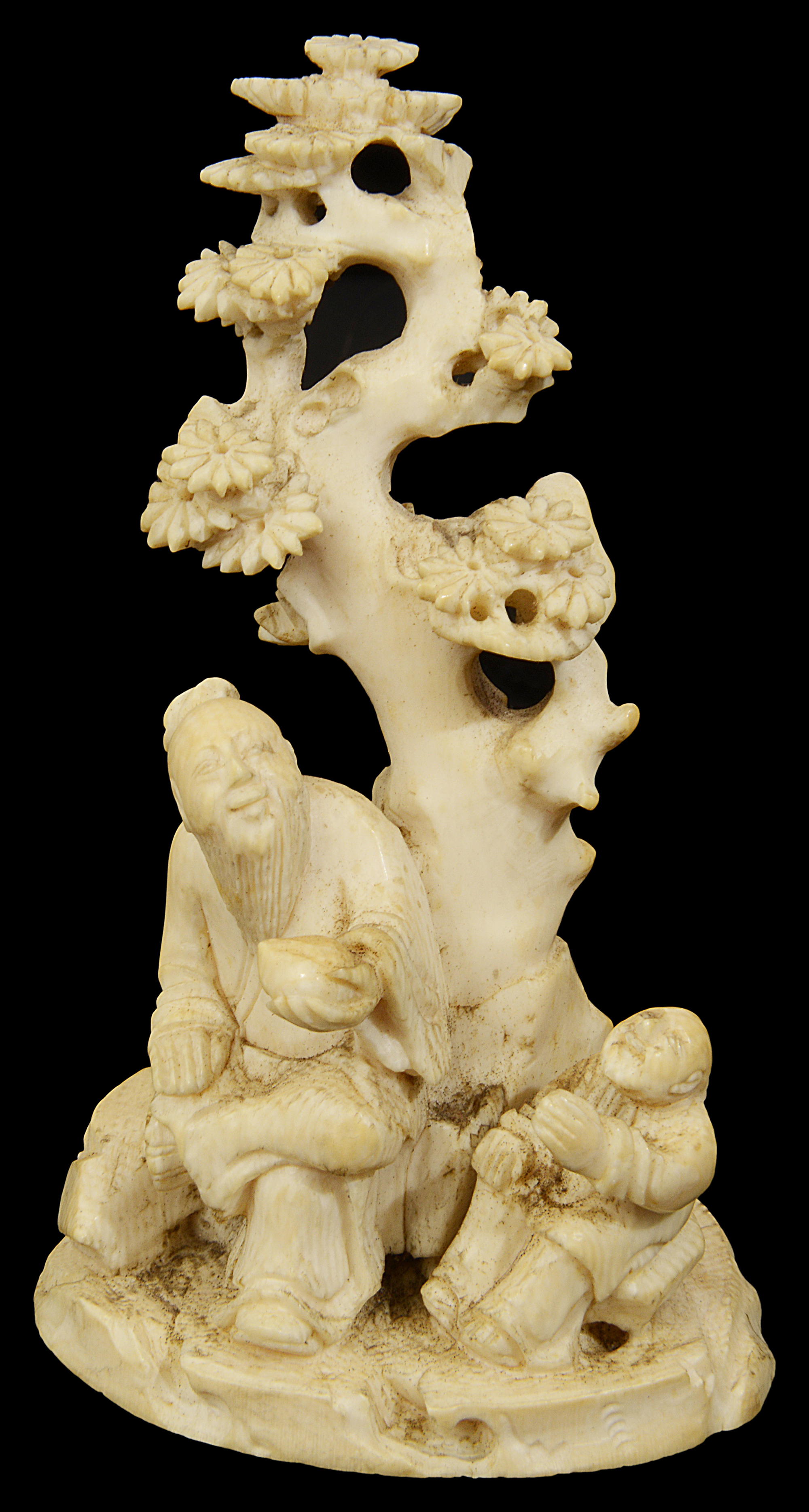 An late 19th/ early 20th century Chinese ivory figure group