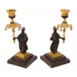 A pair of early 19th c. Regency period gilt and patinated bronze chinoiserie candlesticks c.1820