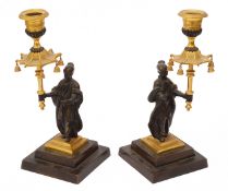 A pair of early 19th c. Regency period gilt and patinated bronze chinoiserie candlesticks c.1820