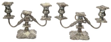 A pair of modern silver three light dwarf candelabra