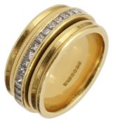 An 18ct yellow gold and diamond-set band ring