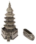 A Chinese export silver novelty pagoda pepper pot and a miniature silver shoe c.1900