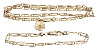 A Continental gold flat link necklace with flower pendant