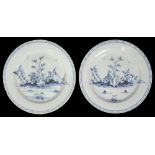 A near pair of mid 18th century English Delft chargers