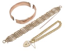 A 9ct gold flat curb link padlock bracelet
