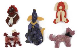 A collection of Lea Stein acrylic dog brooches