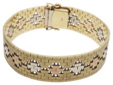 A three coloured gold textured bracelet