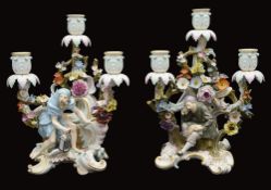 A pair of late 19th century Meissen figural three light candelabra