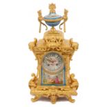 A late 19th century French Louis XVI style ormolu and Sevres style porcelain mounted mantle clock