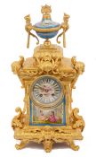 A late 19th century French Louis XVI style ormolu and Sevres style porcelain mounted mantle clock