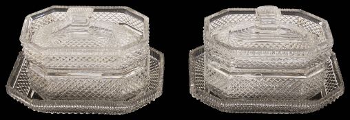 A pair of early 19th century Irish cut glass butter dishes, covers and stands c.1820