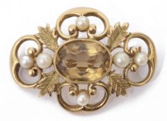 A yellow metal Victorian style citrine and pearl set brooch