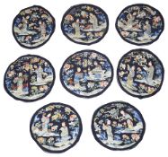 A set of eight Chinese embroidered silk roundels