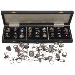 A collection of ninety four 20th century silver and white metal rings,