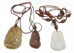 Three contemporary carved jade pendants