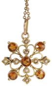 A 9ct gold hesonite garnet and seed pearl Edwardian pendant/brooch