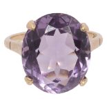 An oval-cut amethyst ring to the plain shank stamped '9ct'