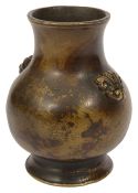 A small early Chinese gilt-splashed bronze vase,