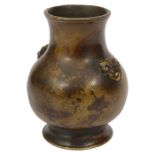 A small early Chinese gilt-splashed bronze vase,