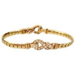 A diamond-set and 18ct yellow gold 'Love Knot' bracelet by Cartier