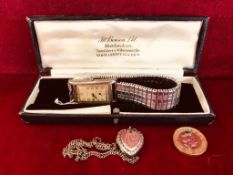 SILVER COLOURED RECTANGULAR WATCH BY BENSON, LONDON (AT FAULT) PLUS SILVER COLOURED HEART LOCKET AND