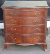 Early / mid 20th century serpentine fronted mahogany chest of four drawers. Approx. 80cms H x