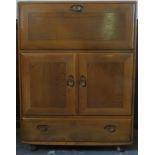 Ercol mid 20th century oak fall front writing cabinet, with fitted interior. Approx. 110cms H x