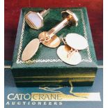 Two pairs of 9ct gold cufflinks, one set with mother of pearl. Gross weight Approx. 17.6g