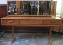 Mid 20th century G Plan style teak mirror backed dressing table. Approx. 116cms H x 153.5cms W x