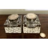 PAIR OF RECTANGULAR CUT GLASS INKWELLS WITH SILVER HINGED COVERS