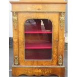 19th century walnut veneered single door glazed pier cabinet, highly decorated with marquetry