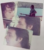 Three colour photographs of Paul McCartney taken during the recording of Band On The Run with one of