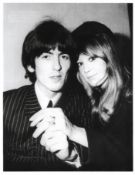 Black and white photograph of George Harrison and Pattie Boyd signed by Pattie Boyd