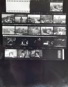 Five contact sheets of photographs of unknown band with corresponding negatives