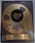 Ampex Golden Reel Award presented to Geoff Emerick for work on Jimmy Buffett Volcano LP