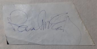 Clipped piece of paper signed by Paul McCartney