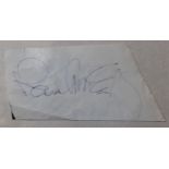 Clipped piece of paper signed by Paul McCartney