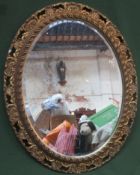 20th century gilt framed oval bevelled wall mirror. Approx. 60cms x 75cms