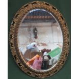 20th century gilt framed oval bevelled wall mirror. Approx. 60cms x 75cms