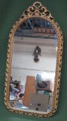 20th century gilt metal framed wall mirror. Approx. 74cms x 37cms