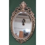 20th century gilt metal framed and bevelled oval wall mirror. Approx. 67cms x 39.5cms