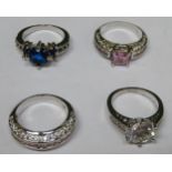 Four various pretty white metal ladies dress rings, set with various coloured stones